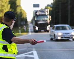Latvian,Police,Man,Is,Directing,Traffic